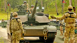 U.S. Army. M1A2 SEPV3 Abrams tanks and an improved ribbon bridge during exercises.