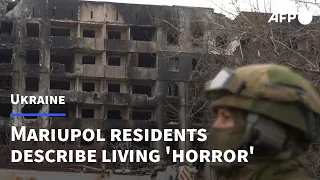 In Mariupol, residents live between destroyed buildings and fresh graves | AFP