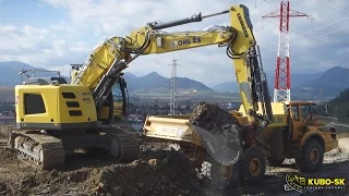 Liebherr R926 excavator loading Volvo A30G dumper with clay