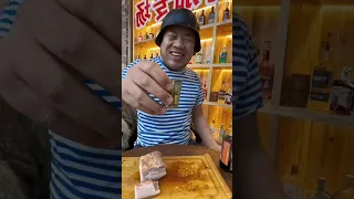 Vodka man eats meat and pickles in store and accidentally hurts his hand