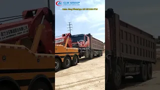 A 10x4 5 Axles 40Tons SHACMAN X3000 Road Recovey Truck Towing a big Breakdown Dump Truck