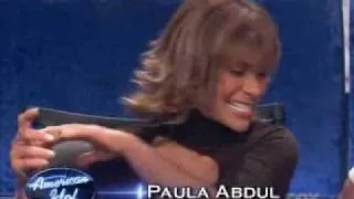 Simon pokes Paula's side