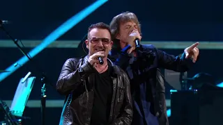 U2 and Mick Jagger perform "Stuck in a Moment You Can't Get Out Of" at the 25th Anniversary concert.