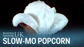 Slow motion video shows close-up of popcorn popping