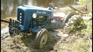 Old tractors struggling // stuck in deep mud // pure sound // pure mud