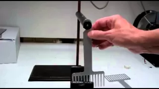 Eddy Currents and Magnetic Braking of a Pendulum Caused by Electromagnetic Induction