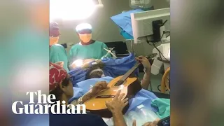 Musician plays guitar while undergoing brain surgery