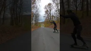 longboard slides and freeride on the hillside