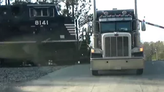 Driver Leaps to Safety as Train Crashes into Truck