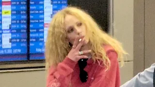 Juno Temple Lets Her Wild Locks Run Free While Enjoying A Smoke At LAX