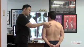 Jeweler with shoulder pain pressure HELPED by Dr Suh Specific Chiropractic