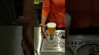 Beer glass fills from bottom