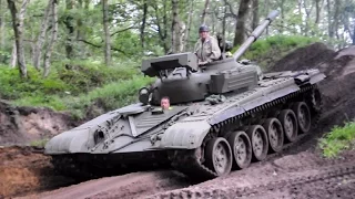 Russian T-72 tank driving in the forest