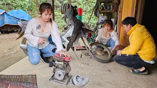 Mechanic girl repairs and replaces motorbike bearings