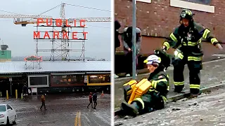 Caught on video: Seattle firefighters & pedestrians slide down slippery streets after ice storm