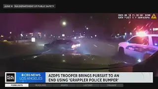 Watch as a police cruiser uses a grappling hook to bring a car chase to an end