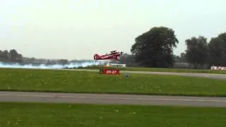Takeoff (PH-PEP, Pitts S2.B Special) with smoke on at Teuge Airport