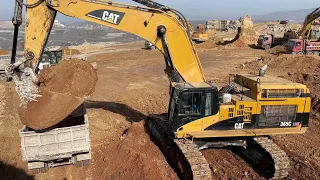 Caterpillar 365C Excavator Loading Trucks