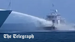 Chinese ships fire water cannons on Philippine resupply vessels in South China Sea