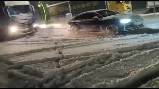 Audi S5 B9 Quattro towing a truck stuck in snow