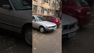 A very clean E34 BMW 5 Series, with hubcaps!