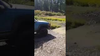 Mike launches his K1500 Blazer through creek