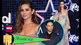 Cheryl dazzles in a glitzy strapless rainbow gown as she takes to the red carpet at the Global Award