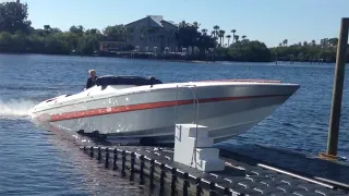 50' cigarette marauder triple mercury 1075 pulling onto floating dock.