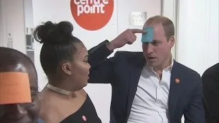 Prince William plays post-it note game during charity visit