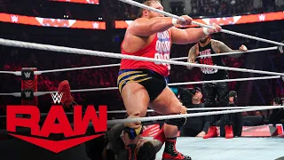 Otis struts across the ring with Jey Uso hanging on to his feet on Raw