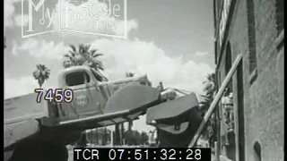 1940s Stunt Large Roller Truck with One Front Tire Rolls Over Man