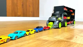 Lot of Tomica Cars sliding down from big Truck Transporter