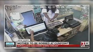 Pregnant worker robber at gunpoint, surveillance video released