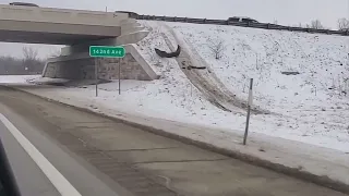 Crash scene where vehicle jumped overpass along Michigan highway