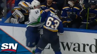 Canucks' Kyle Burroughs Drops Gloves With Blues' Jake Neighbours After Hit On Ethan Bear