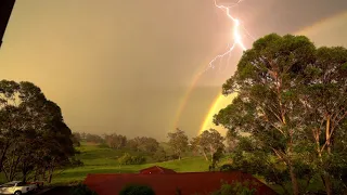 Strange light appears next to double rainbow during thunderstorm 2019 UAP
