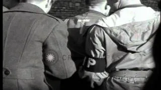 A Nazi war criminal approaches scaffold guarded by American MPs (Military Police)...HD Stock Footage