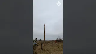 Ukrainian soldiers celebrate after shooting down Russian missile over Kyiv