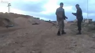 FSA Recoilless Rifle Crew Fires At Syrian Army Building