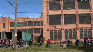 Volunteers clean up former Cooley High School on Detroit's west side