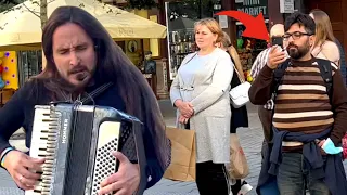 Random people stopped to listen this Polish-Ukrainian song performed by a Colombian band