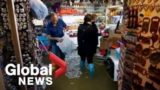 Venice floods can't stop tourists from visiting stores, restaurants
