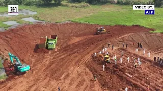 Cemetery workers race to bury bodies as Indonesia faces deadliest Covid-19 wave yet