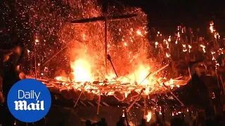 Shetland Islands 'Vikings' take to streets to burn longship with torches - Daily Mail