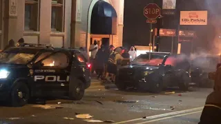 Police cruisers burn in Grand Rapids