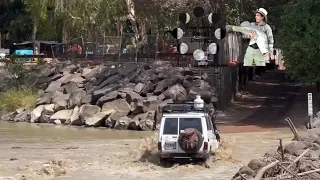 A 4WD Crossing Cahill’s with Crocodiles to the left of screen