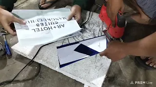 the process of cutting stainless letters using a jigsaw