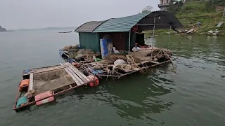 the couples livelihood on the river. they live on rafts and boats  to make a living