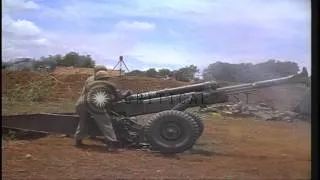 United States 1st Cavalry Division soldiers fire M-102 105 mm Howitzer and unload...HD Stock Footage