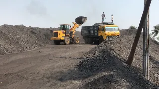 Indonesian coal loading on trucks with wheel loader